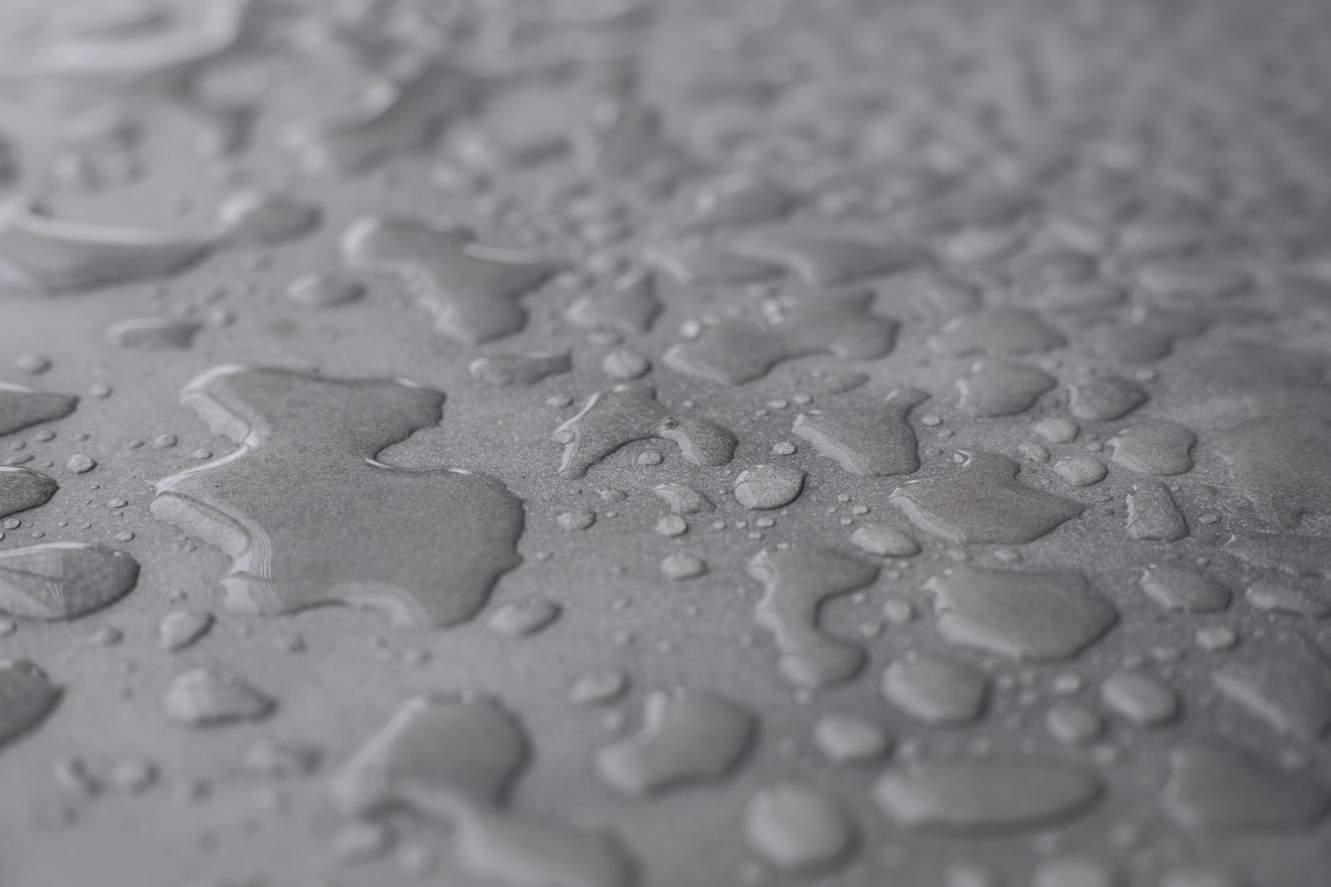 close up photo of waters on grey surface