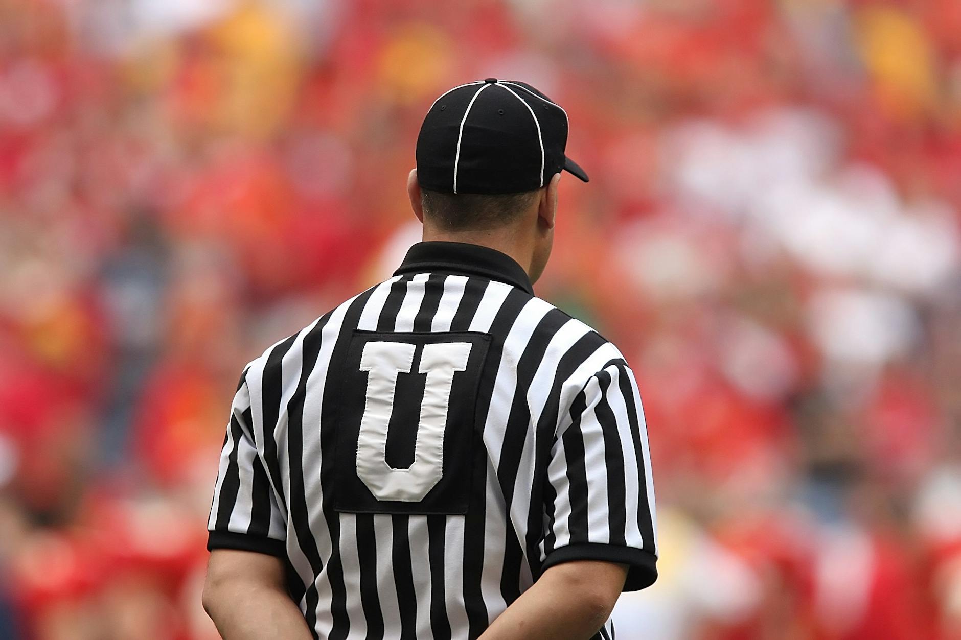 selective focus photography of male umpire